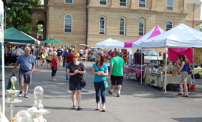 The weekly Farmers Market in downtown Hillsdale was busy Saturday with shoppers also attending the annual Sidewalk Sales. NANCY HASTINGS PHOTO