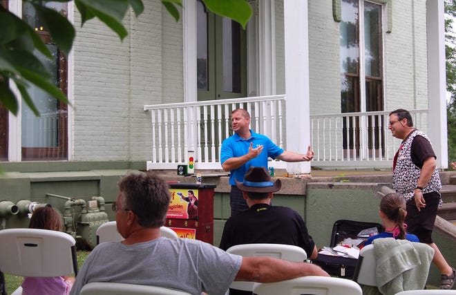 Hillsdale Elks Lodge Exalted Ruler David Beck introduces Magician Jeff Olds, who performed a show on the lawn for special needs children and their families Saturday afternoon. NANCY HASTINGS PHOTO