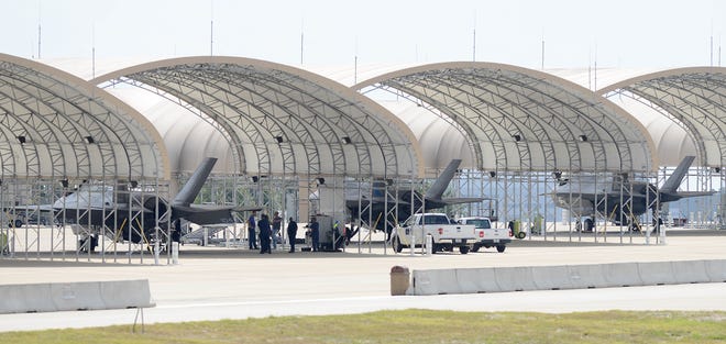 F-35s rest under a canopy on Thursday at Eglin Air Force Base. The fleet of F-35s has been grounded after one of the aircraft caught fire on the runway late last month.
