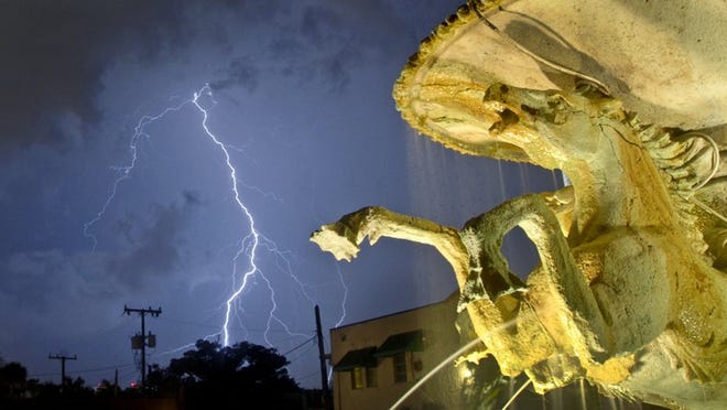 Lightning strikes near Palm Beach, as seen from Mizner Memorial Fountain in the center of town.