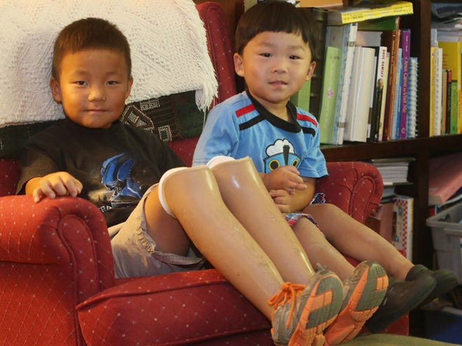 Timothy Lee, 7, and his brother, Samuel, 2, were adopted from China and have both received medical treatments from Shriners Hospitals in Greenville.