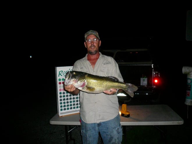 DALE FRANCIS boated this 7 1/2-pound bass on Lake Juliana June 26 in a Ron's Tackle Box evening tournament, which he and Shawn Morgan won. Francis hooked up on an XCalibur XR-50 Royal Shad lipless crankbait, a hot lure Ron Schelfo can hardly keep in stock.