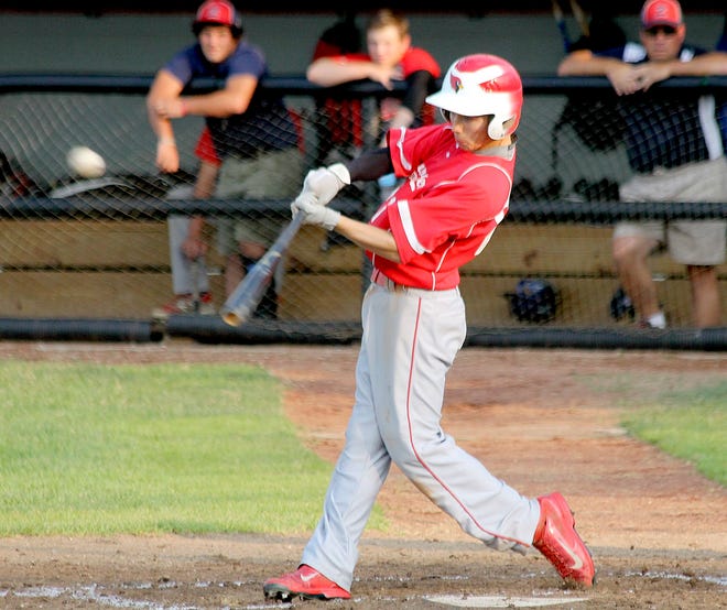 Coldwater's Caleb Letender connects with a pitch to drive in the Cardinals first run of the game Thursday night. ANDY BARRAND PHOTO