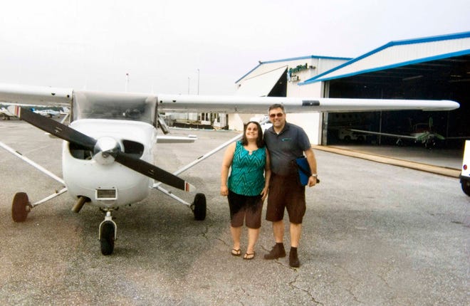 Jordan Ortiz, left, poses with Michael Pahel, the head pilot at Emerald Coast Aviation in Crestview, on June 3.
