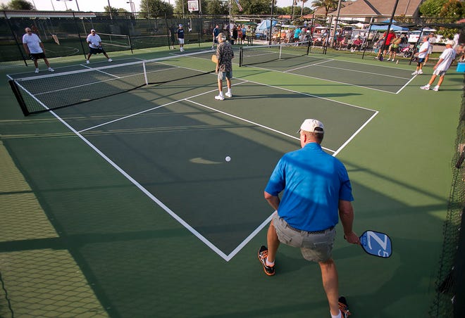 Tom Petelle returns a volley during a men's double match in pickleball Thursday at SummerGlen.