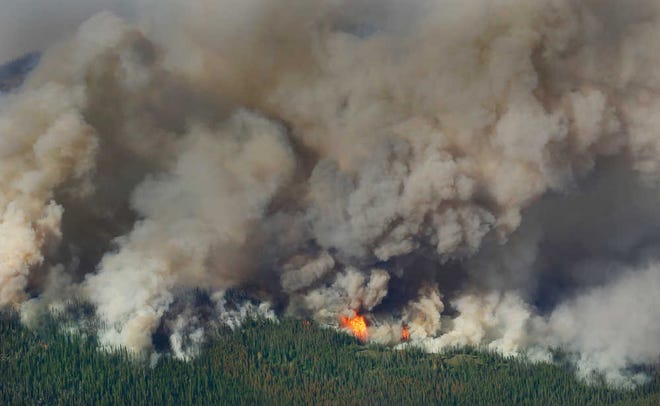 Ted S. Warren/The Associated PressSmoke and flames rise from the Chiwaukum Creek Fire on Thursday near Leavenworth, Wash., in this aerial photo.