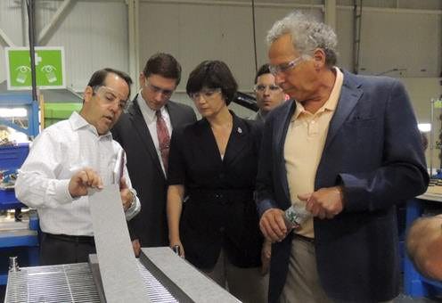 Don Simoneau, senior vice president of operations and CFO of Rypos, left, demonstrates Rypos manufacturing to Christopher Yancich of Rep. Jeffrey Roy’s office, Rep. Carolyn Dykema, Timothy Harvey of Sen. Richard Moore’s office, and Rep. John Fernandes.

Courtesy photo