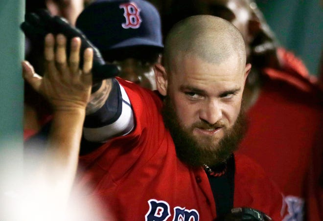 AP photo

Red Sox outfielder Jonny Gomes celebrates his home run against the Royals Friday night at Fenway Park.