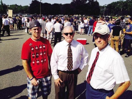 Employees of the Market Basket in Stratham, including from left, Jason Baker (head clerk), Dean Clevesy (associate store director) and Alex Booth (grocery manager) are among at estimated 2,000 on Friday in Tewksbury, Mass., for a protest at the company headquarters.