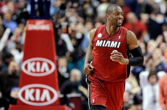 AP PHOTO
Miami Heat guard Dwyane Wade reacts during a 2013 NBA basketball game against the Philadelphia 76ers in Philadelphia.