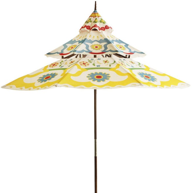 This bright, Oriental-inspired umbrella offers a cheerfull solution to keeping out of the sun's rays.