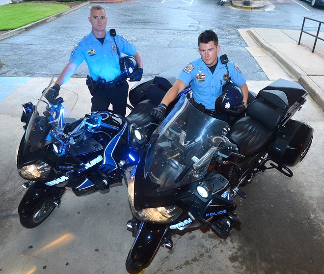 Senior Patrol Officer James Bogan and Patrol Officer McCrary Johnstone show off their new equipment Monday morning at City Hall.