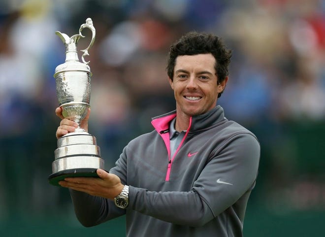 Rory McIlroy of Northern Ireland holds up the Claret Jug trophy after winning the British Open Golf championship.