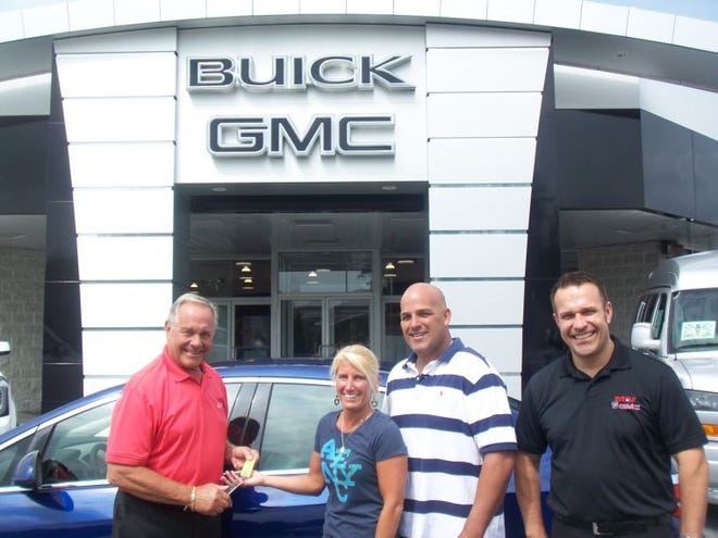 Pictured from left is Clete Landis, owner of Star Buick GMC in Easton; Anne and Greg Chletsos, winners of the Verano car giveaway; and Keith Muir, general manager at Star in Easton.