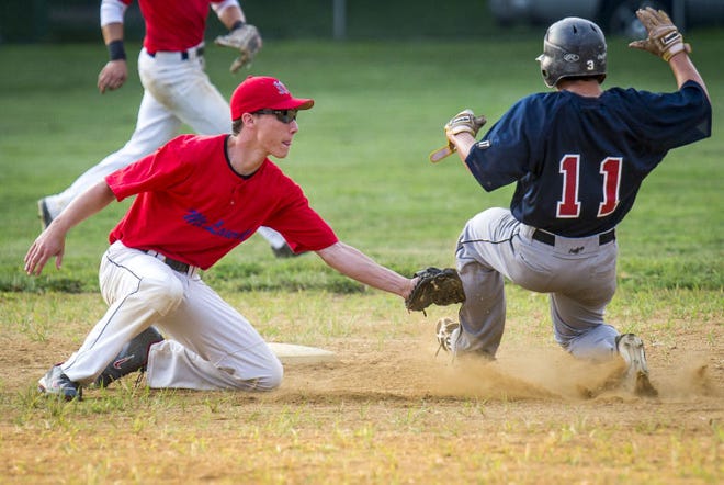 Mount Laurel's Cole Pewor tags out Willingboro's Drew Rodriguez during the RVL Baseball game against Mount Laurel on Tuesday, July 22, 2014 (PHOTO Bryan Woolston / @woolstonphoto)