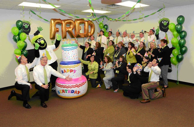 3rd Fed Bank Green Team including Community Ambassador, Bill Clement (far Left), 3rd Fed Bank President and CEO, Kent Lufkin (Second from Left) celebrating the birthday of 3rd Fred, the bank’s friendly mascot.