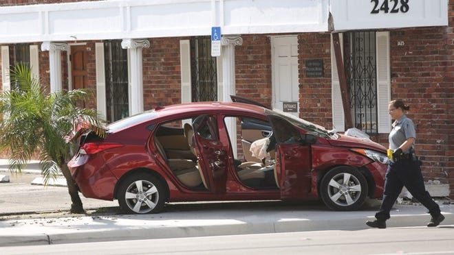 A crashed car near the scene of a shooting at the corner of Broadway and Blue Heron Boulevard in Riviera Beach on Monday, July 21, 2014.