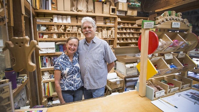 Toymakers Georgean and Paul Kyle pose at their store, Rootin’ Ridge Toymakers, in Austin. The Kyles have created original, hand-crafted wooden toys, games and puzzles for children of all ages since 1975.