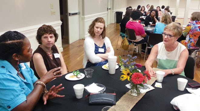 Beth Parrott (right), co-owner of Parrott Insurance, along with Lexington City Councilwoman Tonya Lanier (left) were guest speakers during the 'Words, Women, Wisdom' event Wednesday at the Edward C. Smith Civic Center. They joined a group of other successful women from the community who shared insight to how they achieved success.
