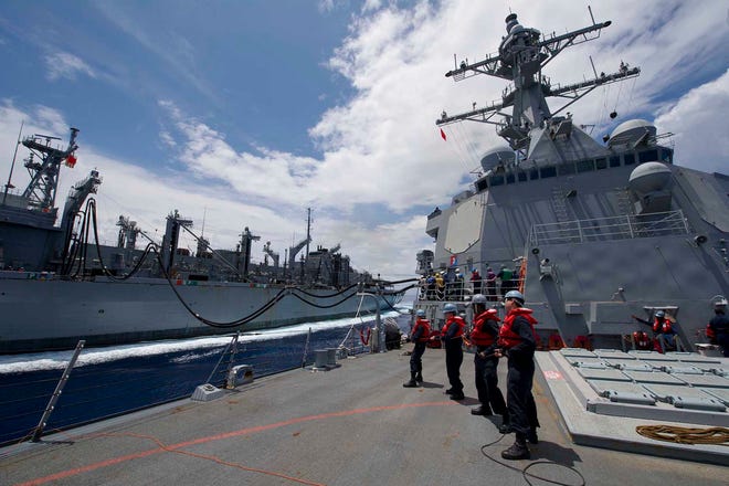 Sailors aboard the Arleigh Burke-class guided-missile destroyer USS Farragut (DDG 99) undergo an underway replenishment for fuel. Farragut was underway last week participating in Exercise Greyhound Armor in support of Destroyer Squadron 2 (DESRON 2).