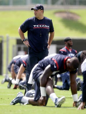FILE - In this June 17, 2014, file photo, Houston Texans head coach Bill O'Brien walks through practice during NFL football minicamp in Houston. (AP Photo/Patric Schneider, File)