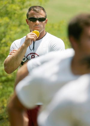 Oklahoma strength and conditioning coach Jerry Schmidt watches Sooners football players run up a hill after lifting weights in 2006. Schmidt, Bob Stoops' second hire upon Stoops' arrival in Norman, is leaving to take a similar job with Texas A&M. [OKLAHOMAN ARCHIVES]
