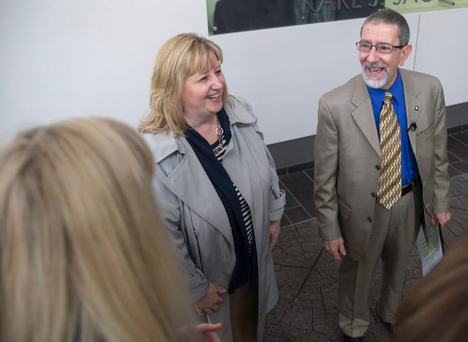 Mike Mastroianni (center) is congratulated after being named Rock Valley College’s president in April.