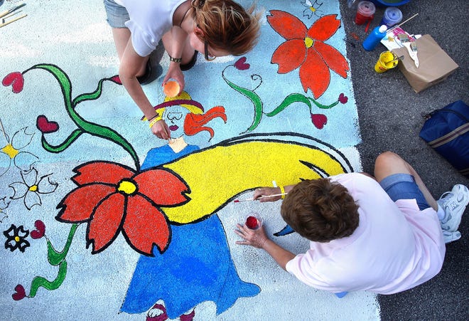 Oak Park resident Shelley LaMantia, top, and Janice Rowe of Springfield participate in the 2013 Paint the Street Festival. This year’s event is Saturday in downtown Springfield.