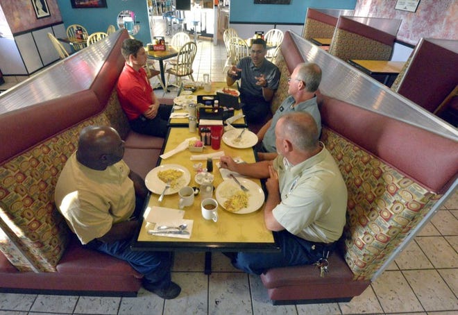 CITY MANAGER JONATHAN EVANS holds a breakfast meeting with a small group of Haines City employees on Thursday to gain their perspective about city government.