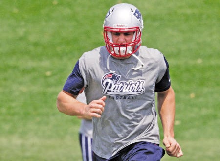 New England Patriots tight end Rob Gronkowski takes part in team minicamp last month in Foxborough, Mass. Gronkowski has been cleared to practice less than eight months after suffering a season-ending knee injury. The star tight end is expected to be on the field today for the Patriots’ first public practice.