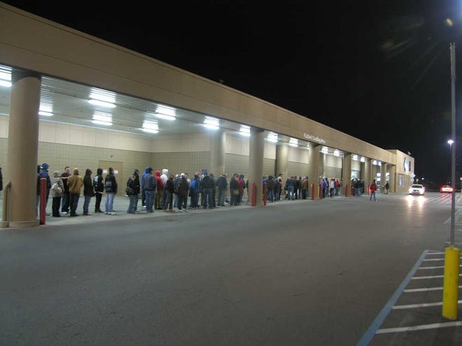 About 200 people wait in line on Black Friday in 2011 at Sam's Club, 1401 S.W. Wanamaker. The Topeka Sam's Club sold some of the fruit recalled for possible listeria contamination.