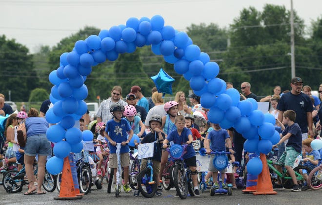 LEVITTOWN, PA - JULY 26: Participants start the Children's Bike Parade in honor of Hope for Hannah at Harry Truman High School July 26, 2014 in Levittown, Pennsylvania. (Photo by William Thomas Cain/Cain Images)