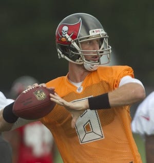 Tampa Bay Buccaneers quarterback Mike Glennon (8) passes the ball during a weather shortened practice on the first day of training camp at One Buc Place in Tampa Friday.