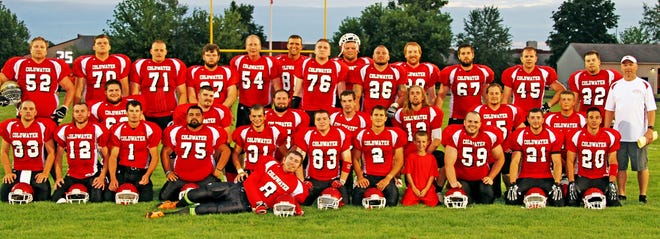 The 2014 Coldwater Cardinals alumni football team poses for a photo at Sturgis High School, where the Trojans won the initial exhibition game 17-6 on Friday. Team members include (first row, from left) Todd Rust, Curt Morrissey, Gavin Kolb, Brian Cancino, Alec Siwik, Coleman Royer, Jacob Cope, Cory Herendeen, Austin Laroe, Cory Nunnery, Jared Tomlinson, Ryan Scheetz, (second row, from left) Tyler McClish, Ryan Bowling, Ben Cappella, Justin Shimp, Scott Frasier, Jimmy Austin, Derek VanEvery, head coach Jeff Schorfhaar, (third row, from left) Jason Thomas, Jacob Hodgson, Jeff Harvey, Devin Burdette, Kenn Klein, Andy Robison, Jason Kelly, Kyle Armstrong, Jordan Harmon, A.J. Bates, Cory Paradine, Rusty Reed and Kyler Palmear.