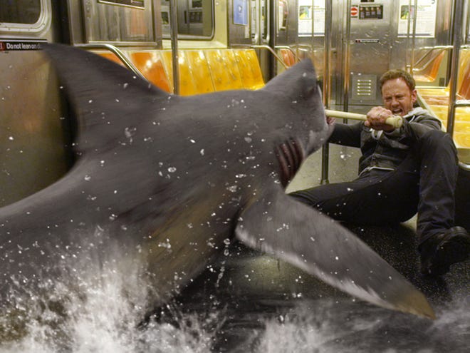 Ian Ziering, as Fin Shepard battles a shark on a New York City subway in a scene from "Sharknado 2: The Second One," premiering Wednesday at 9 p.m.