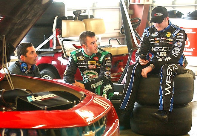 Austin Dillon (center) and Ty Dillon (right) talk with road racing specialist Max Papis durinng testing at Watkins Glen International Monday morning. Papis was brought in to help the young Dillon brothers figure out the road course. Eric Wensel/The Leader
