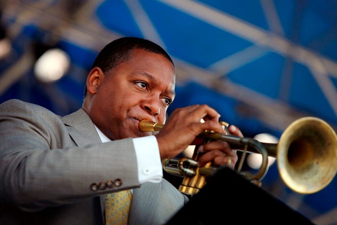 In this Aug. 8, 2010 file photo, trumpeter Wynton Marsalis plays at the Newport Jazz Festival in Newport, R.I. He will be among the featured performers returning to the festival on Saturday, Aug. 2. Marsalis' Jazz at Lincoln Center Orchestra are set to perform some of the signature pieces from Newport's storied past by Thelonious Monk, John Coltrane and Miles Davis, among others.