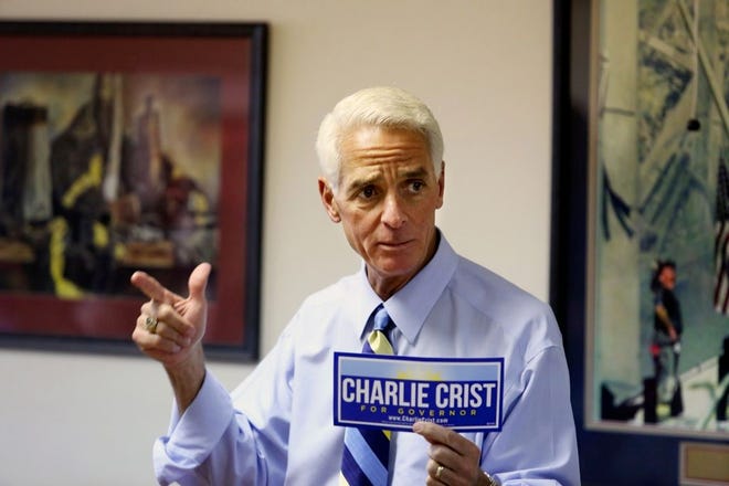 Former Florida Governor and current gubernatorial candidate Charlie Crist speaks to supporters in Gainesville on Friday. Crist began making campaign promises Tuesday, including gay and transgender equality and higher pay for state-hired contractors.