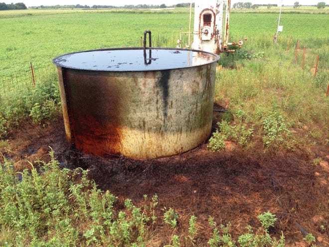Several birds died after coming into contact with an uncovered salt water tank on the Major-Garfield county line last week. The tank has a film of oil on top that spilled onto the ground. PHOTO PROVIDED
  - 
provided