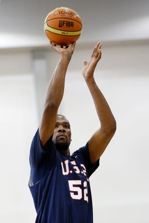 Oklahoma City Thunder's Kevin Durant (52) shoots a free throw during a USA Basketball minicamp scrimmage Monday, July 28, 2014, in Las Vegas. (AP Photo/John Locher)