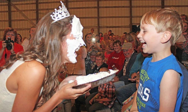 Rhett Howard, 6, won the honor of throwing a pie into the face of Stark County Fair Queen Emily Pasker.