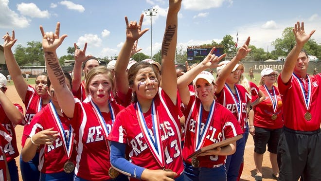 Hays’ Alyssa Martinez, center, and her teammates recognize the fans for their support all season long after a heart-breaking loss. The Aledo Ladycats defeated the Buda Hays Rebels 6-5 in the Texas UIL Class 4A State Semi-final at Red McCombs Field on the University of Texas campus Friday afternoon May 30, 2014.