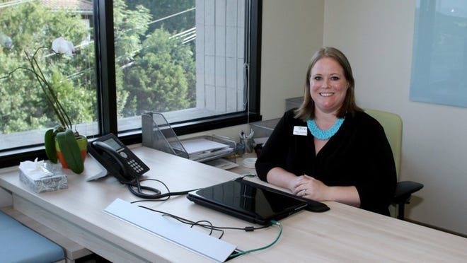Sage Recovery and Wellness Center CEO and Director Tiffany Anschutz sits behind her desk at the newly opened facility.