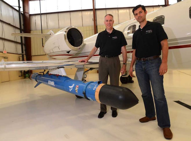 Generation Orbit, a company specializing in launching nano-satellites into space, staged their first launch maneuver test flight of the GO Flight Experiment Testbed, a tubular rocket mounted below the wing of a Learjet 35 aircraft, on Wednesday July 30, 2014 from Cecil Spaceport on Cecil Airport in Jacksonville. John R. Olds (L) Chief Executive Officer of Generation Orbit Launch Services, Inc. and A.J. Piplica, Chief Operating Officer stand by the GO Flight Experiment Testbed before the flight. The inert rocket-shaped system was loaded with electronics to test conditions during a series of launch maneuvers flown approximately 200 miles off the coast.