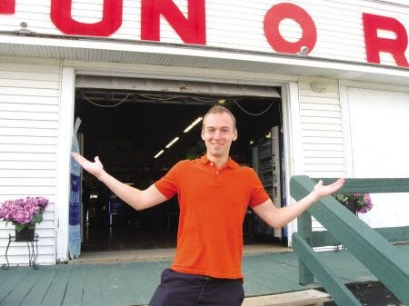 Ilya stands outside of the Fun-O-Rama in York Beach, where he worked as a seasonal worker and returned this year to visit friends.