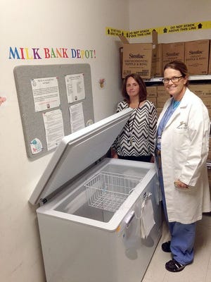 Laura Benting, nursing director of the BirthPlace at Beth Israel Deaconess Hospital-Plymouth, and Dr. Brigid McCue, the hospital's chief of obstetrics and gynecology, show off the freezer they will use to open the hospital's new human milk depot.