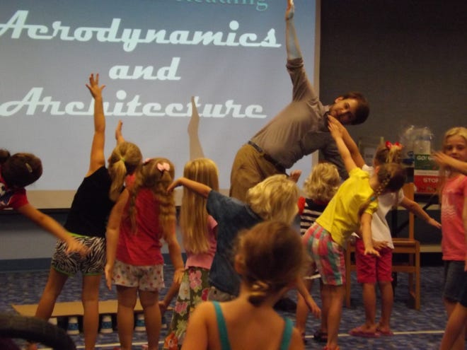 Port Orange Children's Librarian Thomas Jonte gets kids up and moving during the aerodynamics and architecture summer class which is part of the Florida Library Youth Program themed, "Fizz-BOOM-Read."