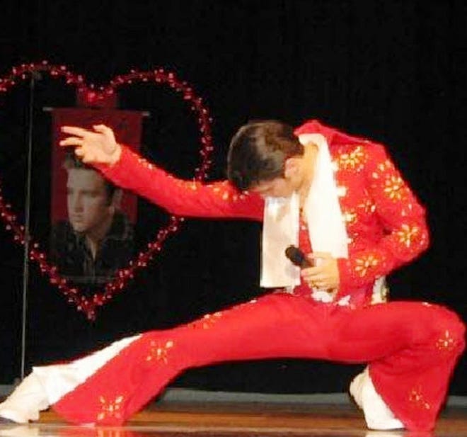 Elvis impersonator Jake Slater performs a burning love pose during a performance.