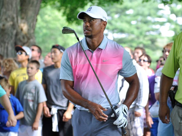 Tiger Woods watches a shot at the Bridgestone Invitational on Thursday. (Phil Long | Associated Press)