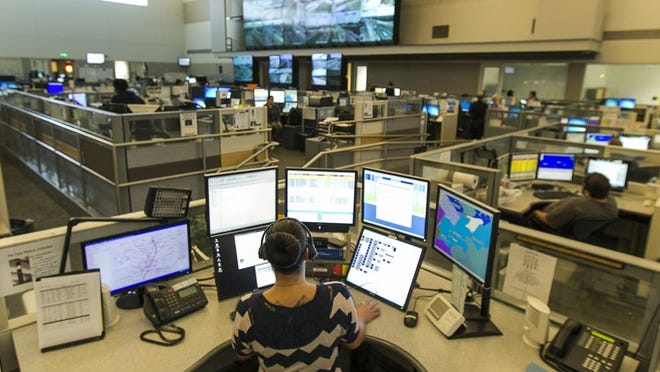 Austin police dispatcher, Cassi Urbanski, 25, monitors her sector at the 911 call center in Austin on Thursday. The proposed city budget that officials are considering would add additional employees such as another relief dispatcher on the floor to help with the workload. (RODOLFO GONZALEZ / AMERICAN-STATESMAN)